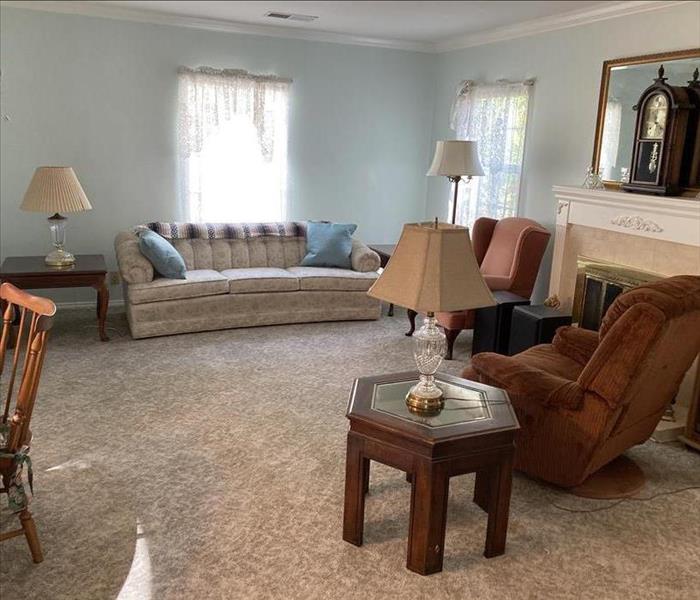 Family room with new carpet and ceiling 