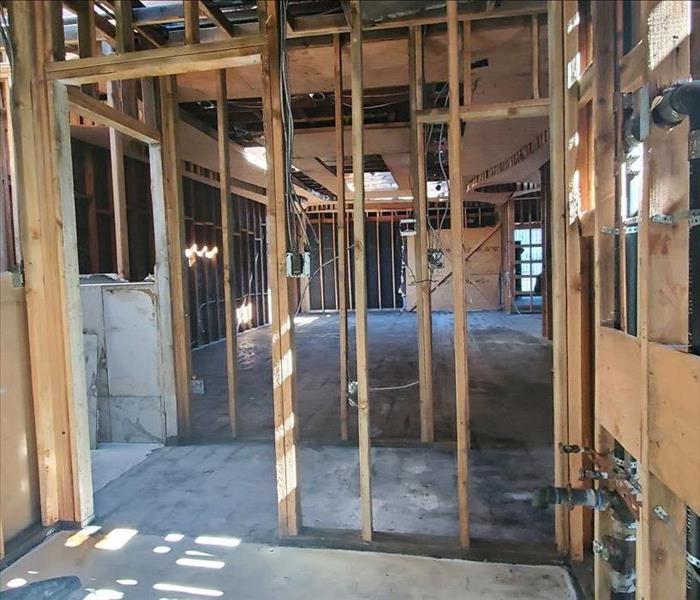 Building with removed drywall and burnt materials 